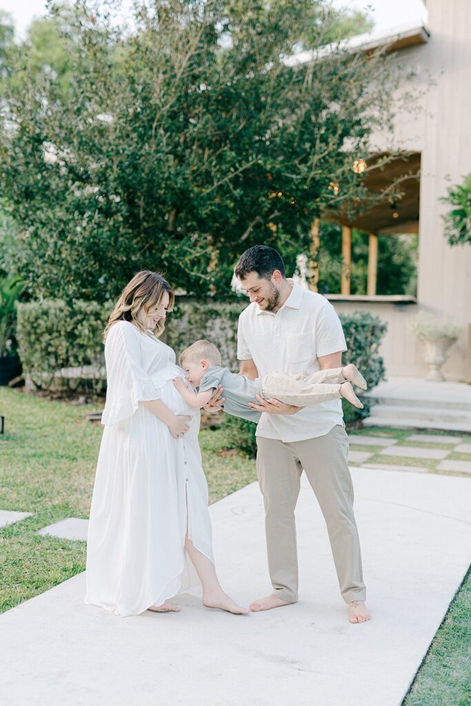 Candid outdoor family portrait with natural styling — taken by a Jupiter, FL photographer offering stress-free, full-service sessions for growing families.